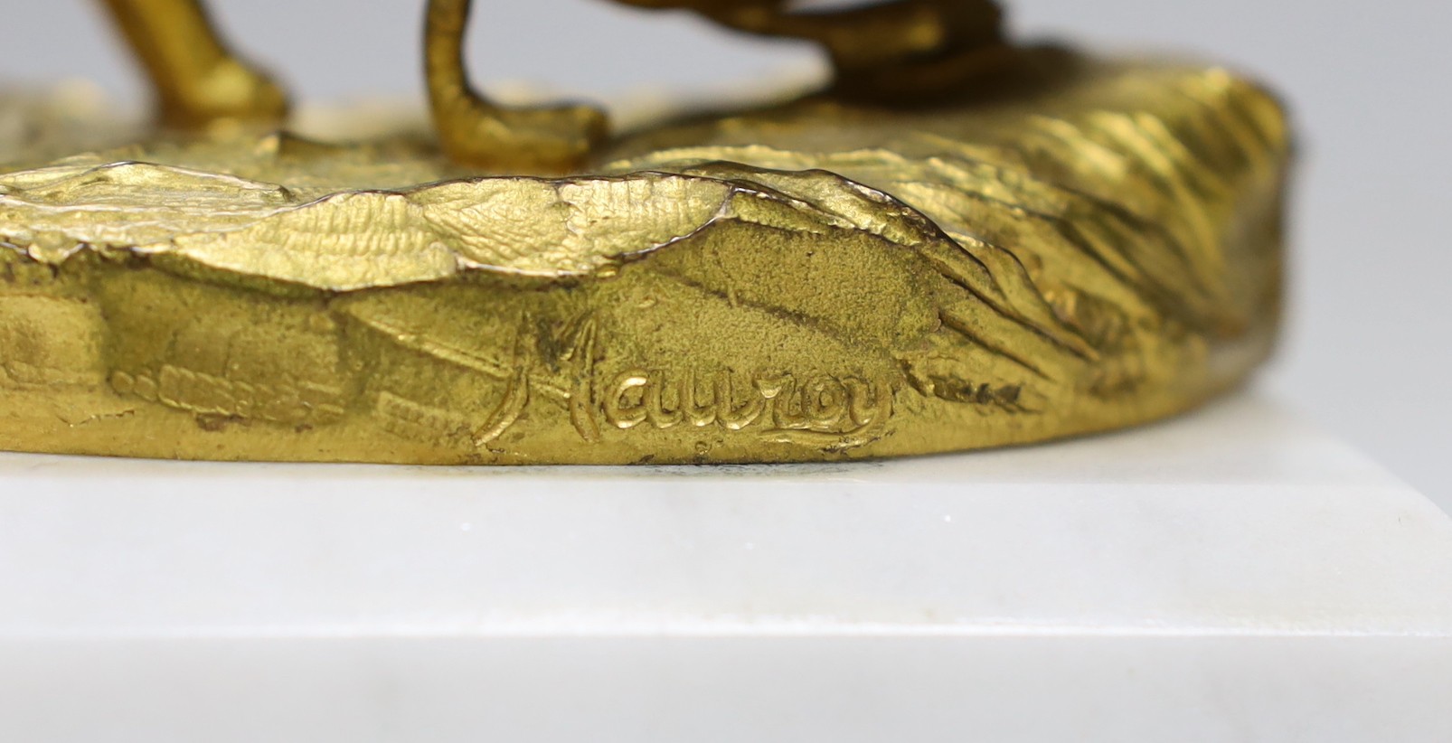 A gilt-bronze model dog and duck signed Mauroy, on marble base, 13.5cm long
